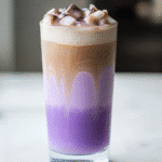 serving iced ube coconut latte
