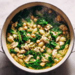 High-protein post-gym pasta simmering in a single pot on stovetop