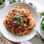 One-pot spaghetti Bolognese for one served on white countertop in fall